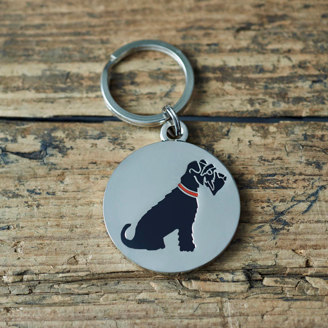 Close-up of Black Schnauzer dog ID tag — silver-plated brass with illustrated Black Schnauzer design, personalised dog tag by Sweet William Designs