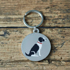 Close-up of Black & White Springer Spaniel dog ID tag — silver-plated brass with illustrated Springer Spaniel design, personalised dog tag by Sweet William Designs