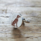 Close-up of personalised Vizsla cufflink engraved with name on rustic wood — silver-plated gift for Vizsla owners