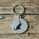 Close-up of Yorkshire Terrier dog ID tag — silver-plated brass with illustrated Yorkie design, personalised dog tag by Sweet William Designs