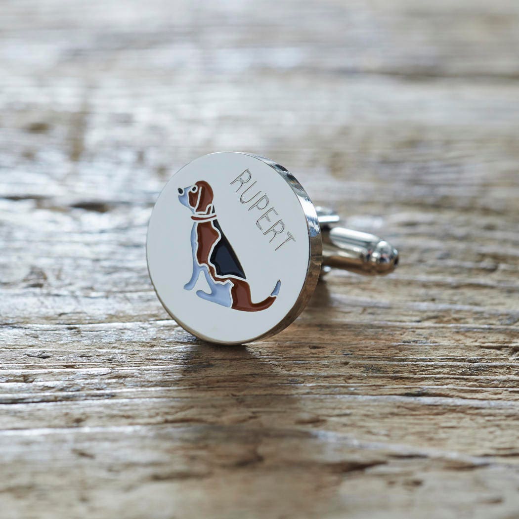 Close-up of personalised Beagle cufflink engraved with name on rustic wood — silver-plated gift for Beagle owners