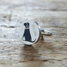 Close-up of personalised Black Labrador cufflink engraved with name on rustic wood — silver-plated gift for Black Lab owners