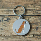 Close-up of Boxer dog ID tag — silver-plated brass with illustrated Boxer design, personalised dog tag by Sweet William Designs
