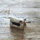 Close-up of personalised Dachshund cufflink engraved with name on rustic wood — silver-plated gift for Dachshund owners