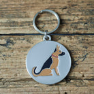 Close-up of German Shepherd dog ID tag — silver-plated brass with illustrated German Shepherd design, personalised dog tag by Sweet William Designs