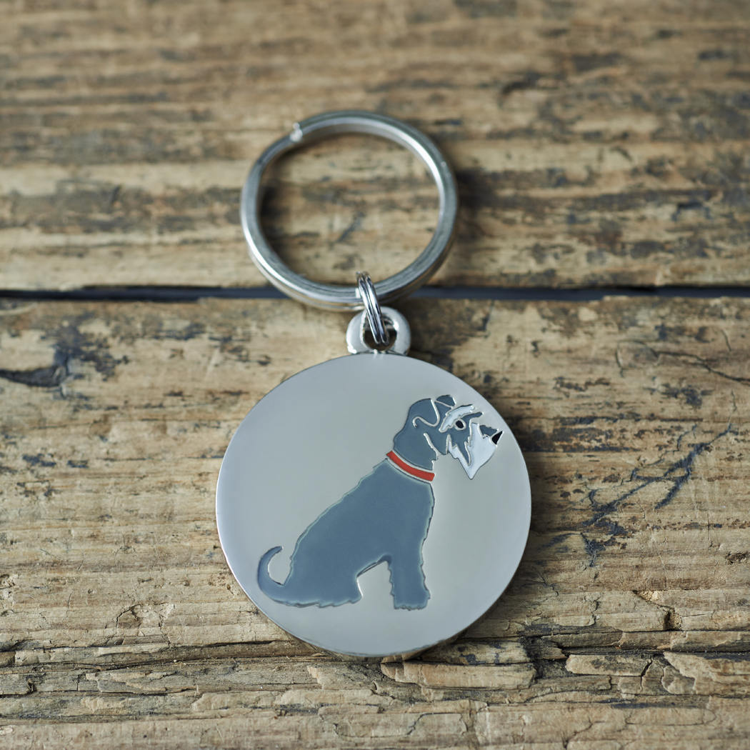 Close-up of Grey Schnauzer dog ID tag — silver-plated brass with illustrated Grey Schnauzer design, personalised dog tag by Sweet William Designs