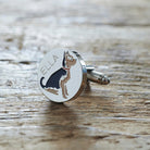 Close-up of personalised Yorkshire Terrier cufflink engraved with name on rustic wood — silver-plated gift for Yorkie owners