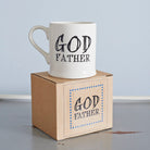 Ceramic Godfather mug displayed on its kraft gift box, a thoughtful godparent gift