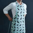 Black Schnauzer apron in organic cotton canvas with screen-printed Schnauzer repeat pattern — gift for Schnauzer lovers by Sweet William Designs