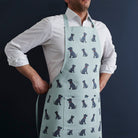 Staffie organic cotton apron — screen-printed repeat pattern, front pocket & adjustable strap, gift for Staffie lovers