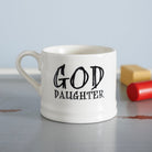 Ceramic “God Daughter” mug photographed beside colourful toy blocks, a thoughtful gift for a goddaughter