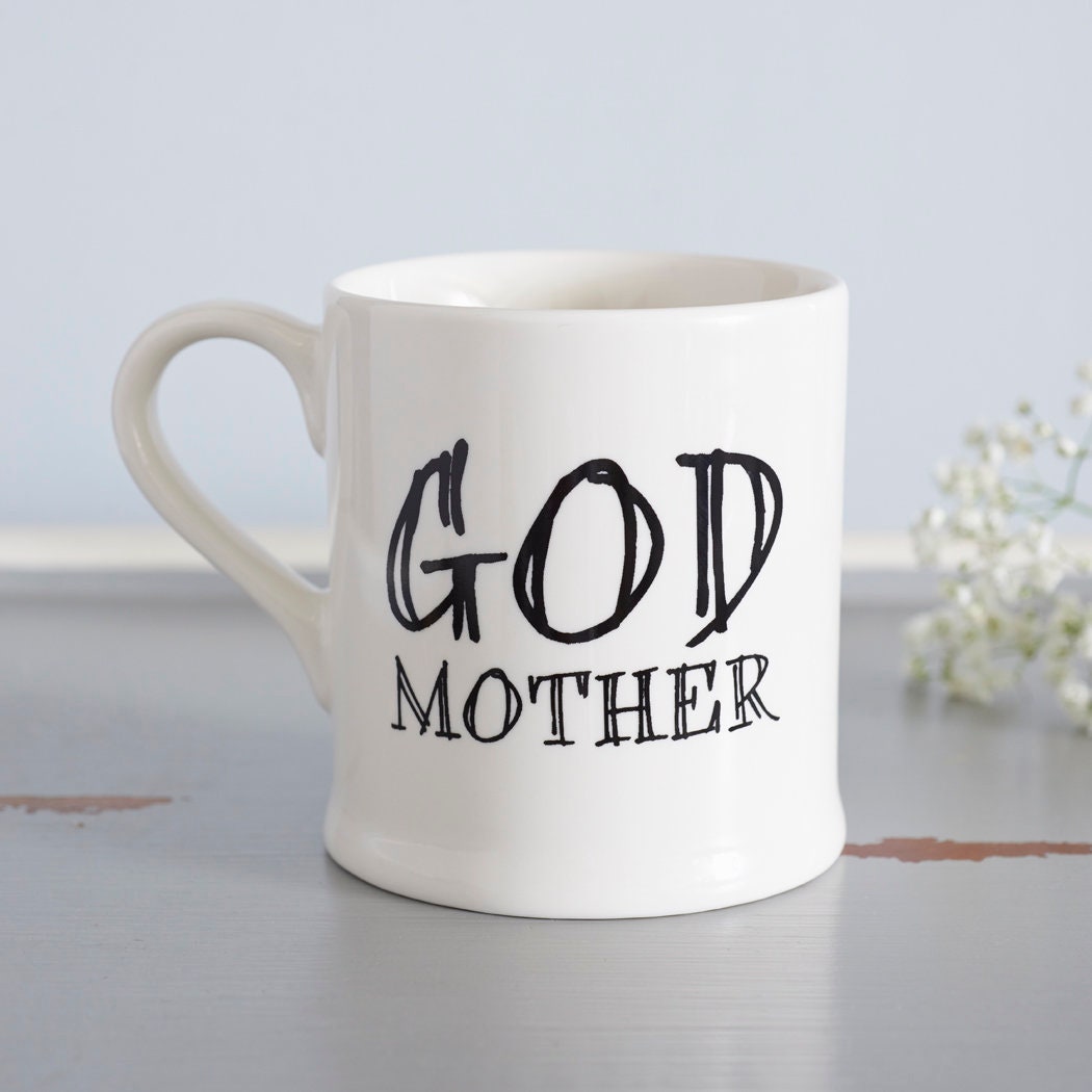 Ceramic Godmother mug styled with delicate white flowers, a thoughtful godparent gift from Sweet William Designs