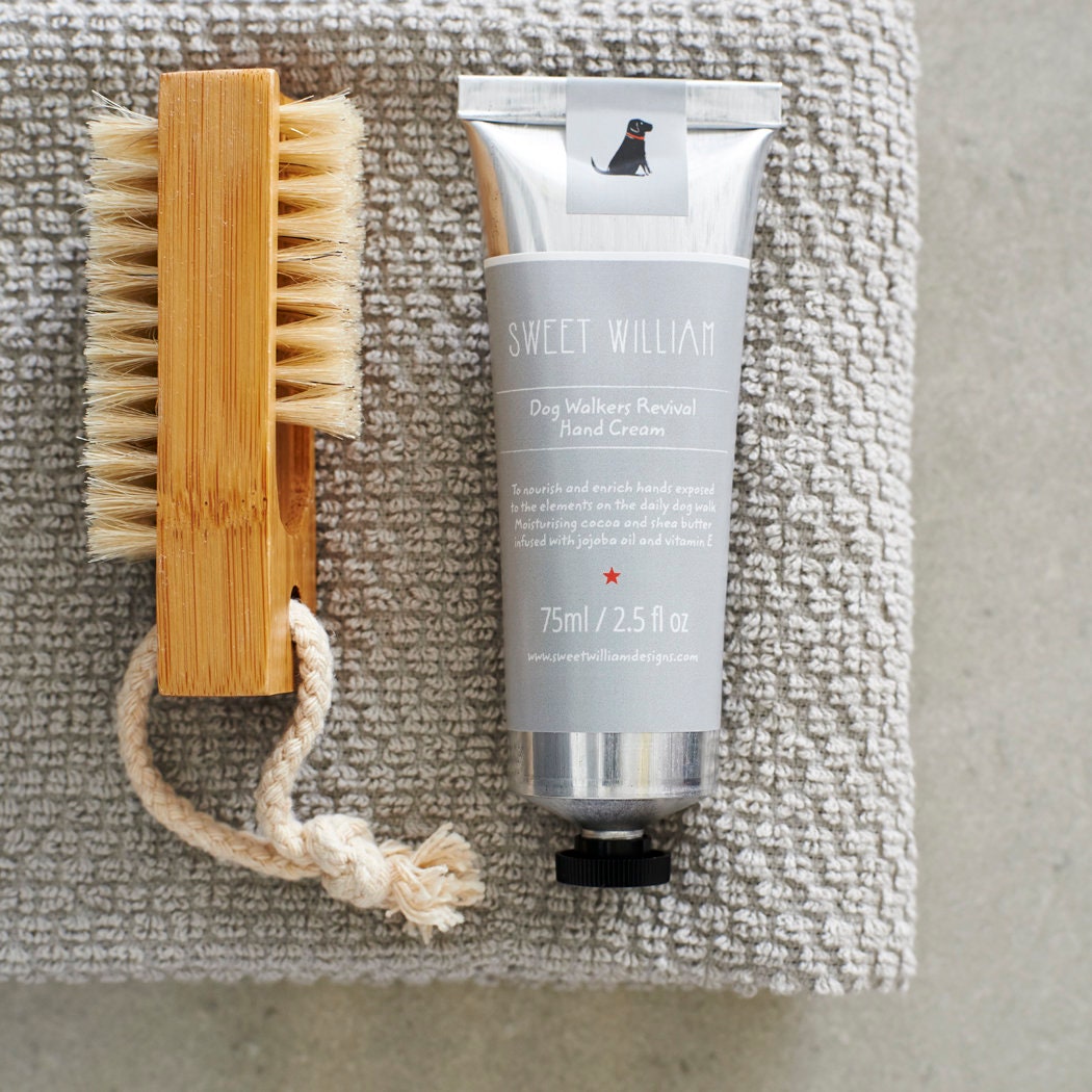 Dog Walkers Revival Hand Cream styled with a small wooden brush, a thoughtful gift for dog walkers by Sweet William Designs