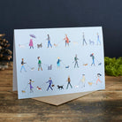 Dog Walkers greeting card standing upright — colourful illustrated dog walkers, perfect gift for dog lovers by Sweet William Designs
