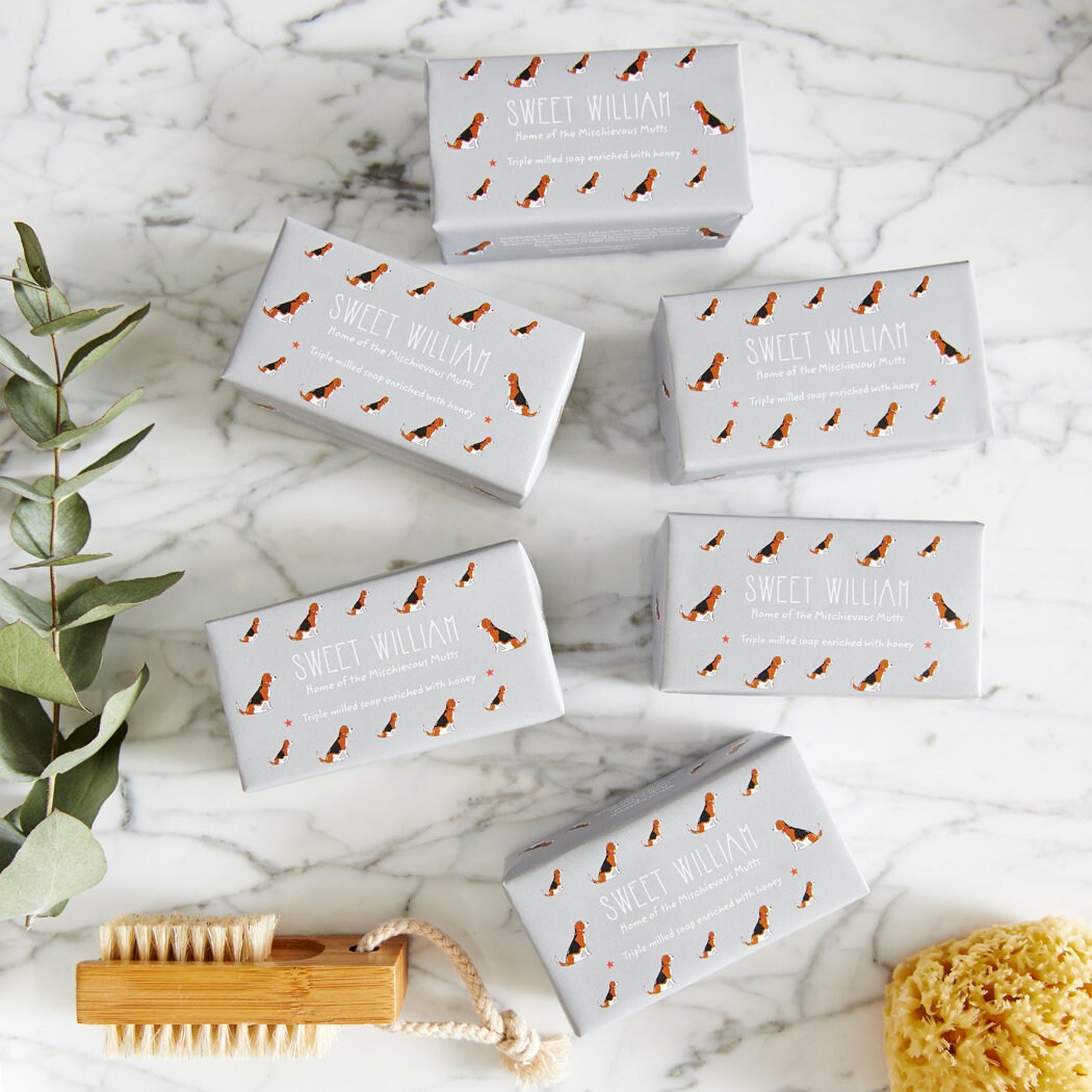 Collection of Beagle triple milled soaps on marble surface — honey-enriched luxury dog lover gift by Sweet William Designs