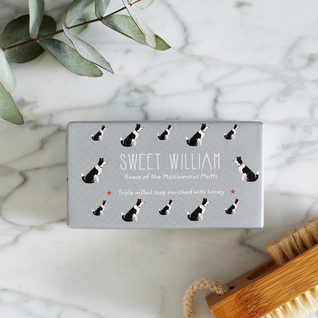 Close-up of Border Collie soap packaging — Sweet William triple milled soap enriched with honey, illustrated Border Collie repeat pattern