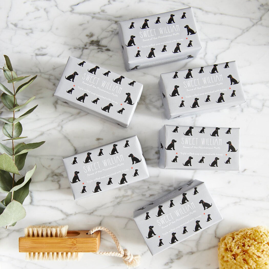 Collection of Black Cocker Spaniel triple milled soaps on marble surface — honey-enriched luxury dog lover gift by Sweet William Designs
