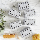 Collection of Black Cocker Spaniel triple milled soaps on marble surface — honey-enriched luxury dog lover gift by Sweet William Designs