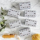 Collection of Dachshund triple milled soaps on marble surface — honey-enriched luxury dog lover gift by Sweet William Designs