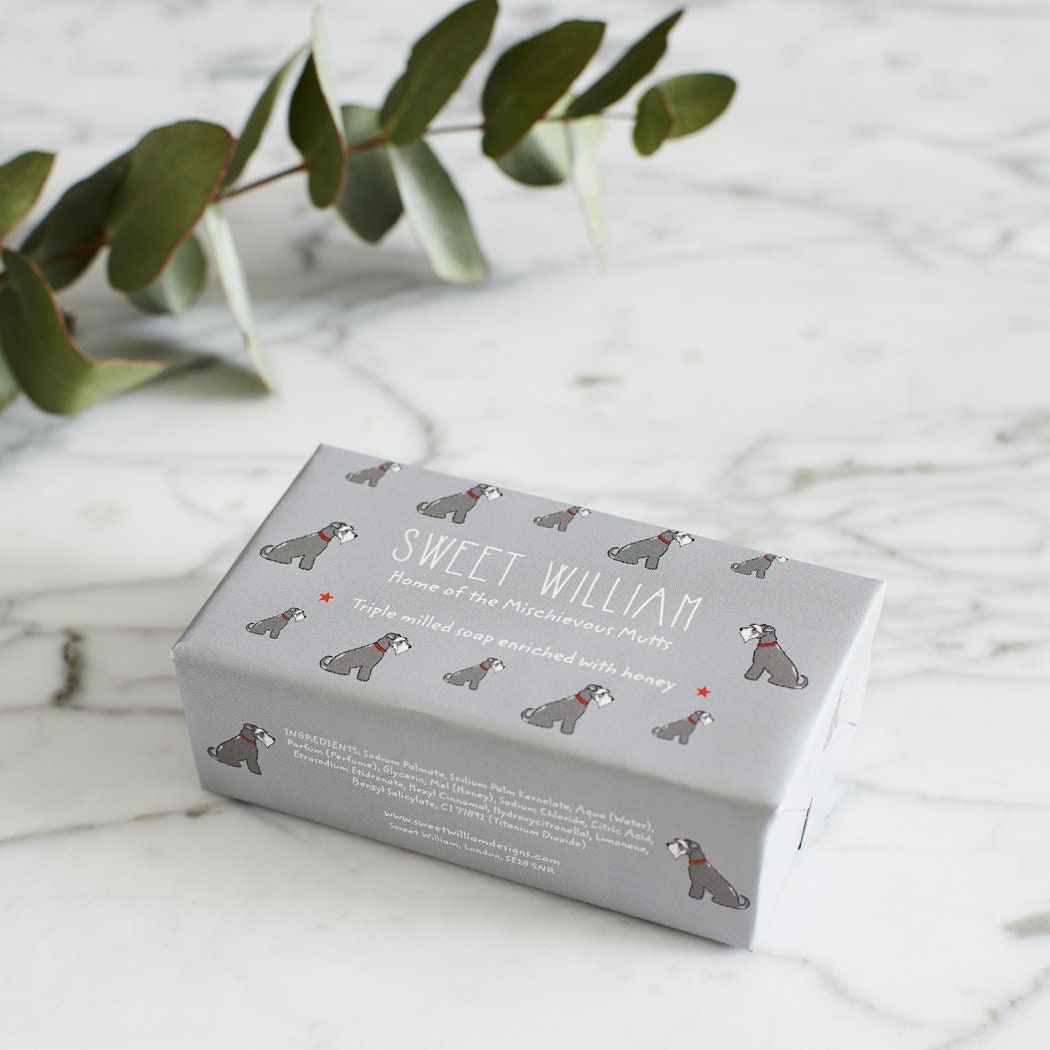 Grey Schnauzer triple milled soap on marble surface — honey-enriched luxury soap in Grey Schnauzer illustrated packaging by Sweet William Designs