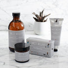 Dog Walkers Revival Collection arranged on a marble surface featuring bath foam, soap, foot cream and hand cream — thoughtful dog walker gift by Sweet William Designs