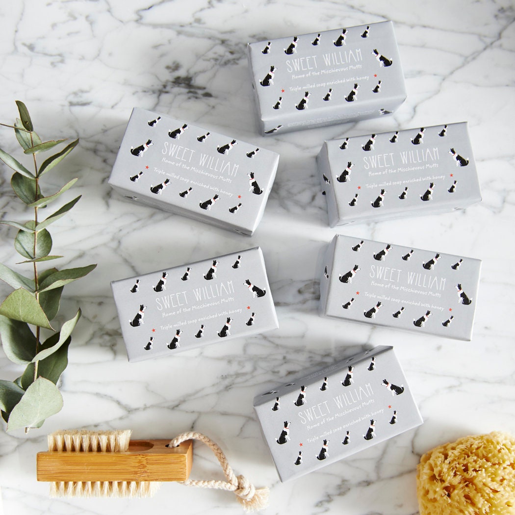 Collection of Border Collie triple milled soaps on marble surface — honey-enriched luxury dog lover gift by Sweet William Designs