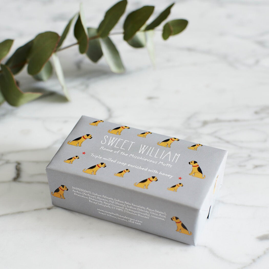 Border Terrier triple milled soap on marble surface — honey-enriched luxury soap in Border Terrier illustrated packaging by Sweet William Designs