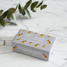 Border Terrier triple milled soap on marble surface — honey-enriched luxury soap in Border Terrier illustrated packaging by Sweet William Designs