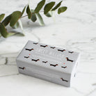 Dachshund triple milled soap on marble surface — honey-enriched luxury soap in Dachshund illustrated packaging by Sweet William Designs
