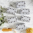 Collection of French Bulldog triple milled soaps on marble surface — honey-enriched luxury dog lover gift by Sweet William Designs
