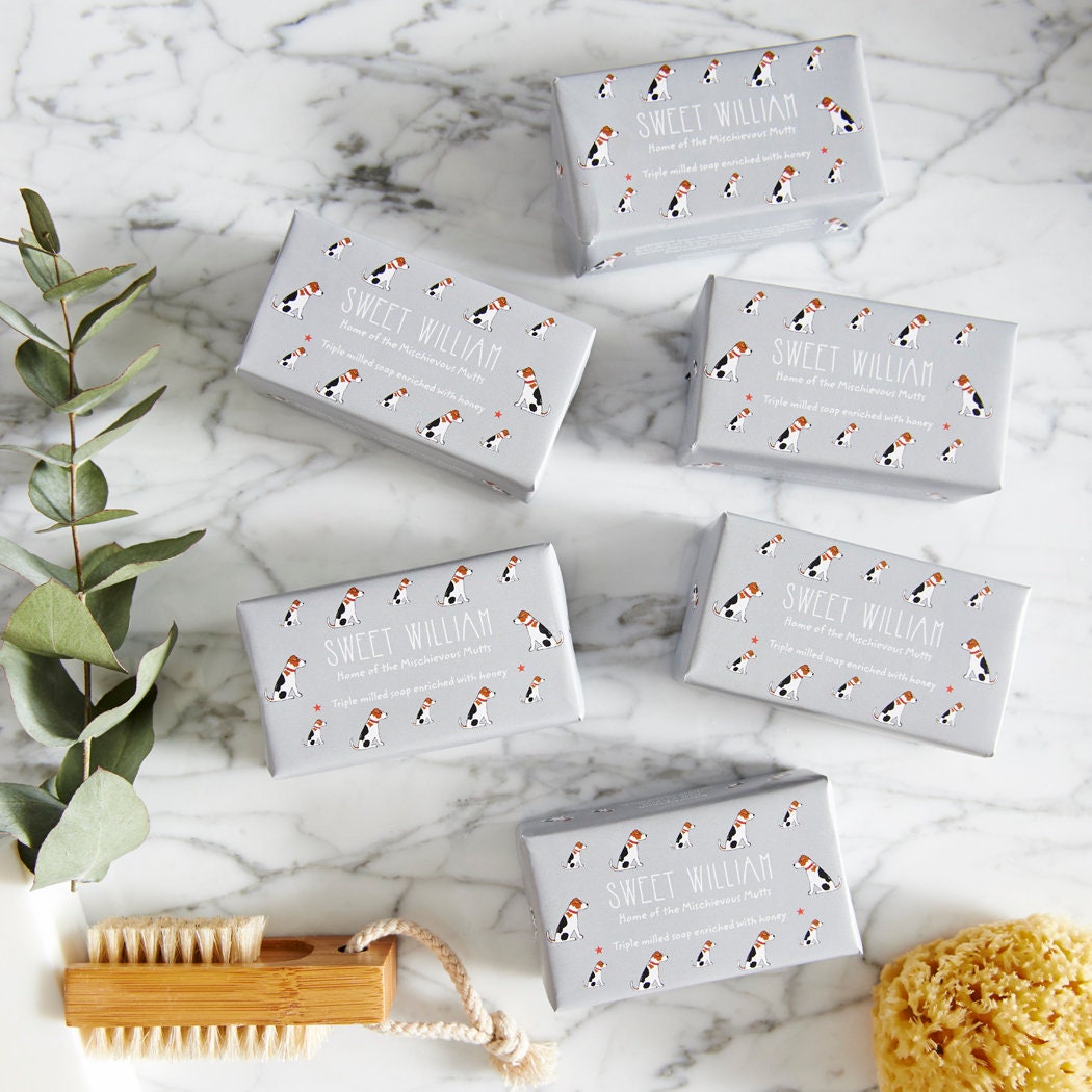 Collection of Jack Russell triple milled soaps on marble surface — honey-enriched luxury dog lover gift by Sweet William Designs