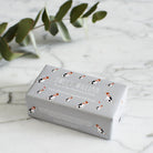 Jack Russell triple milled soap on marble surface — honey-enriched luxury soap in Jack Russell illustrated packaging by Sweet William Designs