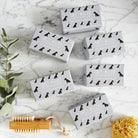Collection of Black Schnauzer triple milled soaps on marble surface — honey-enriched luxury dog lover gift by Sweet William Designs