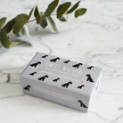 Black Schnauzer triple milled soap on marble surface — honey-enriched luxury soap in Black Schnauzer illustrated packaging by Sweet William Designs