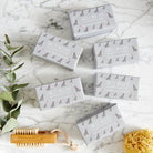 Collection of Grey Schnauzer triple milled soaps on marble surface — honey-enriched luxury dog lover gift by Sweet William Designs