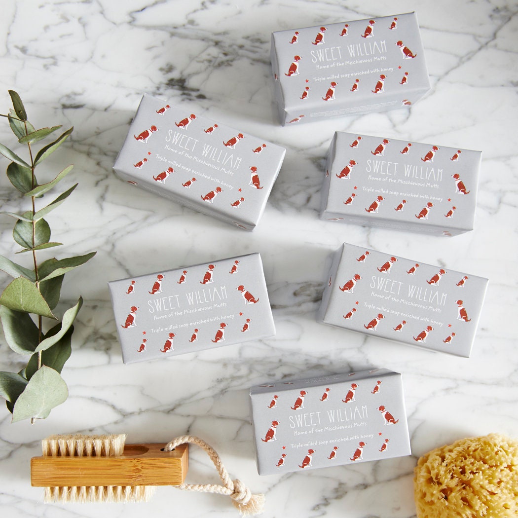 Collection of Liver & White Springer Spaniel triple milled soaps on marble surface — honey-enriched luxury dog lover gift by Sweet William Designs