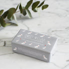 Westie triple milled soap on marble surface — honey-enriched luxury soap in Westie illustrated packaging by Sweet William Designs