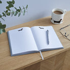 Open Dachshund notebook showing lined pages with sausage dog header illustration — A5 hardback notebook, dog lover gift