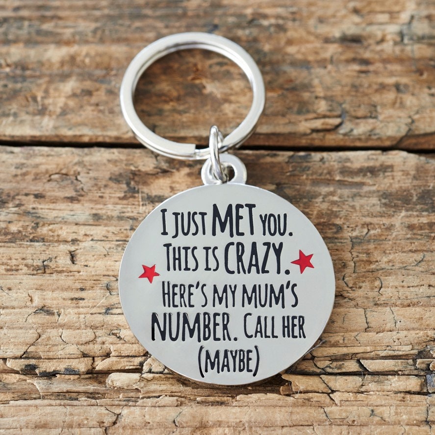 Close-up of 'I Just Met You This Is Crazy' dog tag — silver-plated brass with red star design, personalised dog ID tag by Sweet William Designs