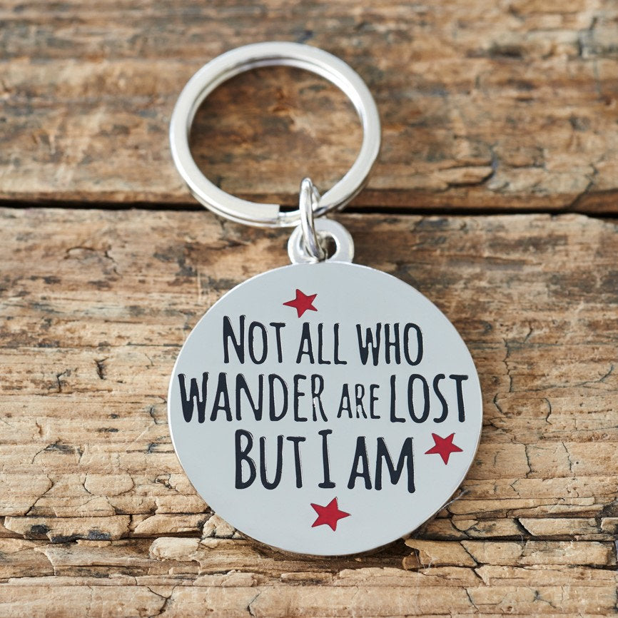 Close-up of 'Not All Who Wander Are Lost But I Am' dog tag — silver-plated brass with red star design, personalised dog ID tag by Sweet William Designs 