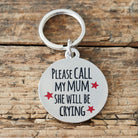 Close-up of 'Please Call My Mum She Will Be Crying' dog tag — silver-plated brass with red star design, personalised dog ID tag by Sweet William Designs
