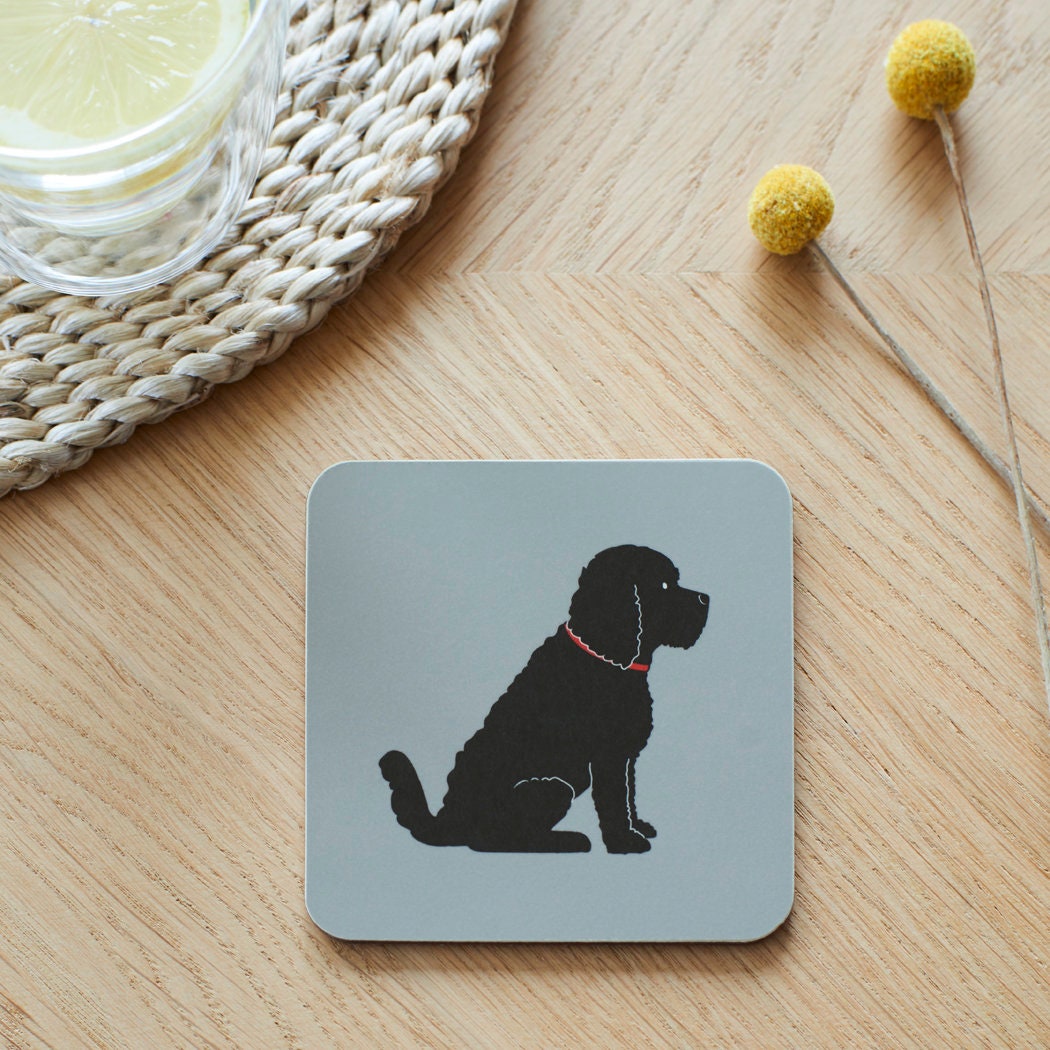 Close-up of Black Cockapoo / Labradoodle coaster — sustainably sourced eucalyptus wood with cork backing, heat-resistant and easy to wipe clean