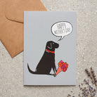 Black Labrador Mother's Day card featuring illustrated Black Labrador holding flowers — blank inside, supplied with kraft envelope, by Sweet William Designs