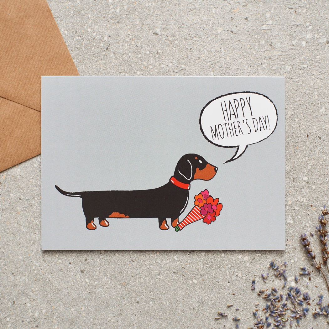 Dachshund Mother's Day card featuring illustrated Dachshund holding flowers — blank inside with optional handwritten message, perfect gift for dog mums