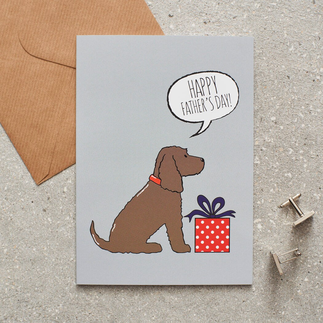 Cocker Spaniel (Chocolate) Father's Day card — illustrated dog with gift and 'Happy Father's Day' message, dog lover gift by Sweet William Designs