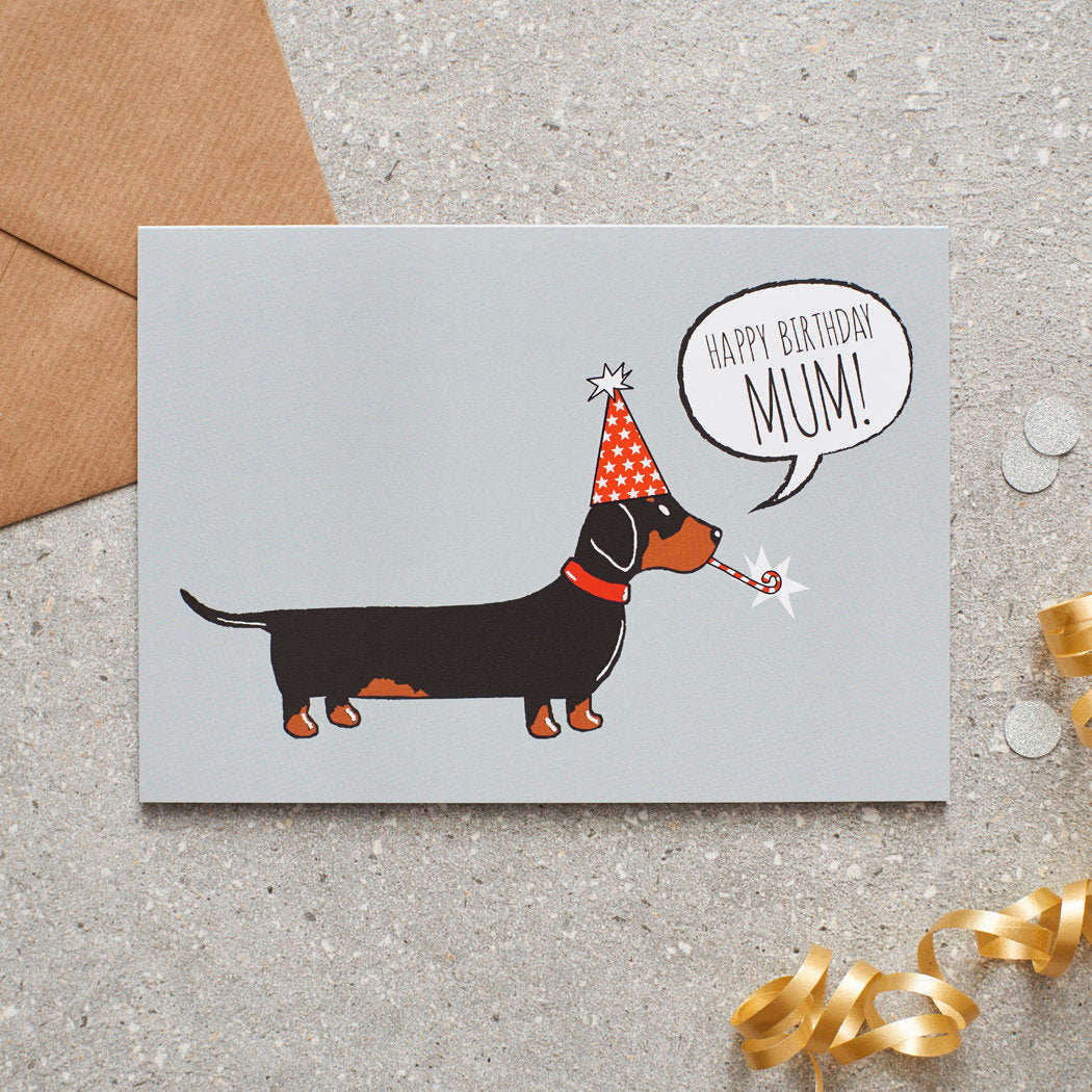 Dachshund ‘Happy Birthday Mum’ card featuring a Sausage Dog in a party hat, a lovely choice for Dachshund-loving mums by Sweet William Designs