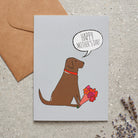 Chocolate Labrador Mother's Day card featuring illustrated Chocolate Labrador holding flowers — blank inside, supplied with kraft envelope, by Sweet William Designs