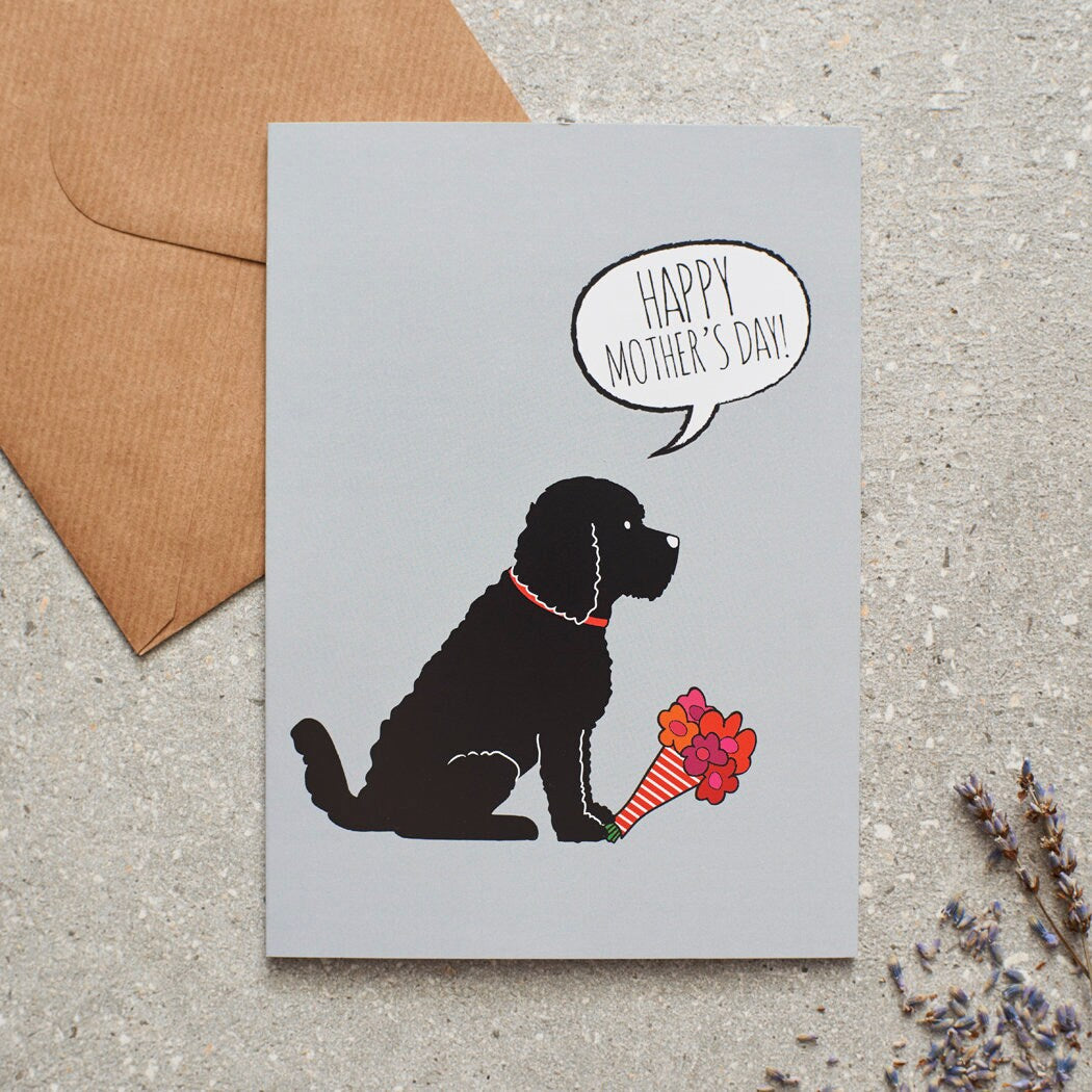 Cockapoo / Labradoodle (Black) Mother's Day card featuring illustrated Black Cockapoo holding flowers — blank inside, supplied with kraft envelope, by Sweet William Designs