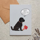 Cockapoo / Labradoodle (Black) Mother's Day card featuring illustrated Black Cockapoo holding flowers — blank inside, supplied with kraft envelope, by Sweet William Designs