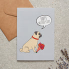 Pug Mother's Day card featuring illustrated Pug holding flowers — blank inside with optional handwritten message, perfect gift for dog mums